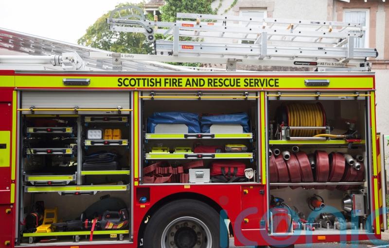 Fire engine in collision with two cars while travelling under blue lights