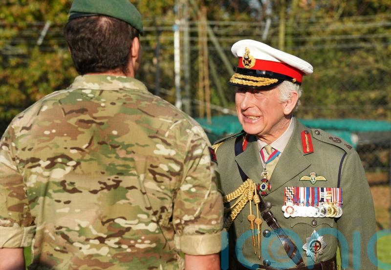 King returns to Royal Marines training base to meet recruits