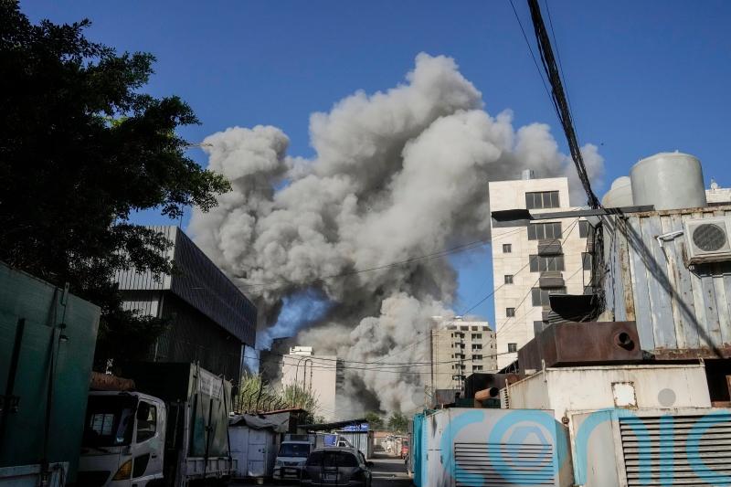 Israeli strike in Beirut kills Hezbollah official, while strike in Gaza kills 30