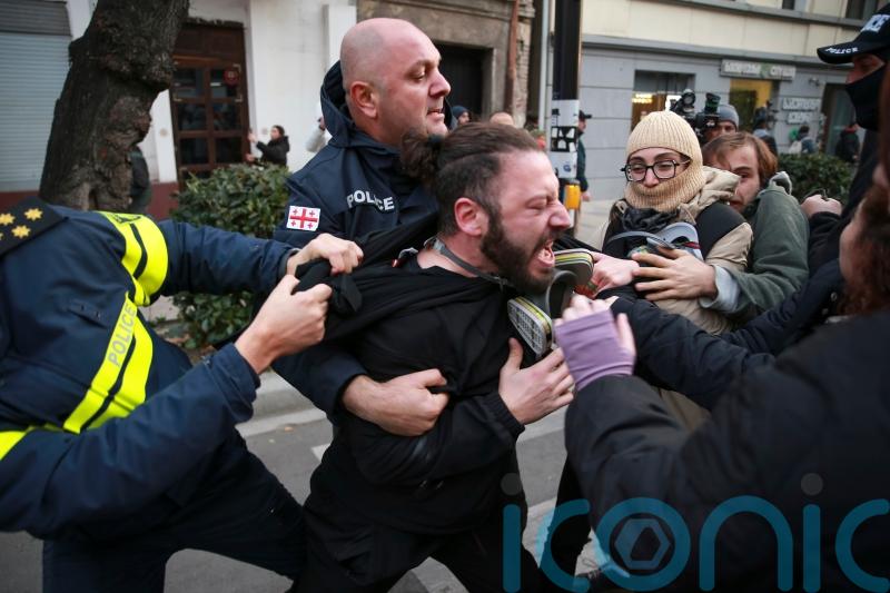Police in Georgia break up Tbilisi protesters’ camp but they quickly return