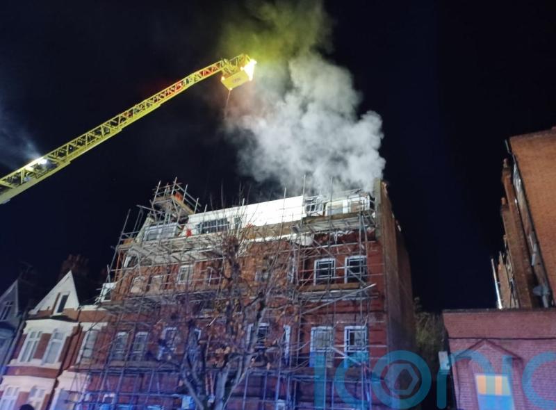 Around 100 firefighters tackling takeaway, flat blaze