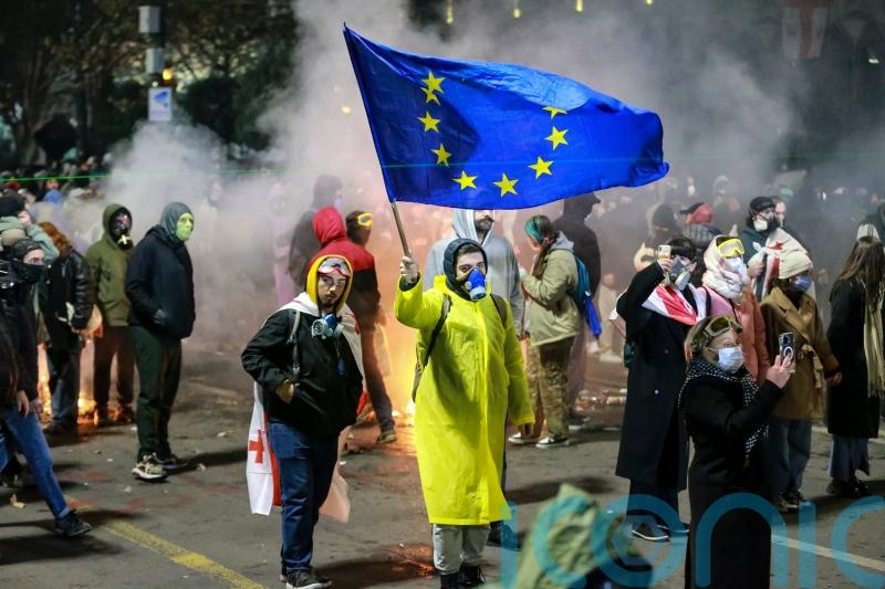 Protesters gather for third night of demonstrations over move to halt EU talks