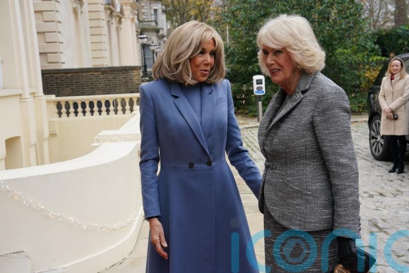 Recovering Queen embraces France’s first lady at literary award ceremony