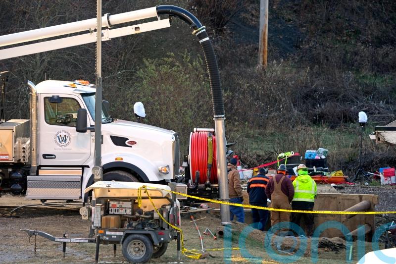 Rescuers change tactics in search for woman who may have fallen into sinkhole