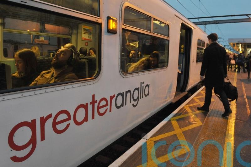 What proportion of rail services will be in public hands by the end of 2025?