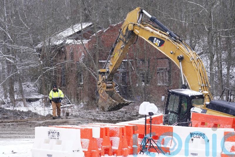Searchers recover body in hunt for woman believed to have fallen into sinkhole
