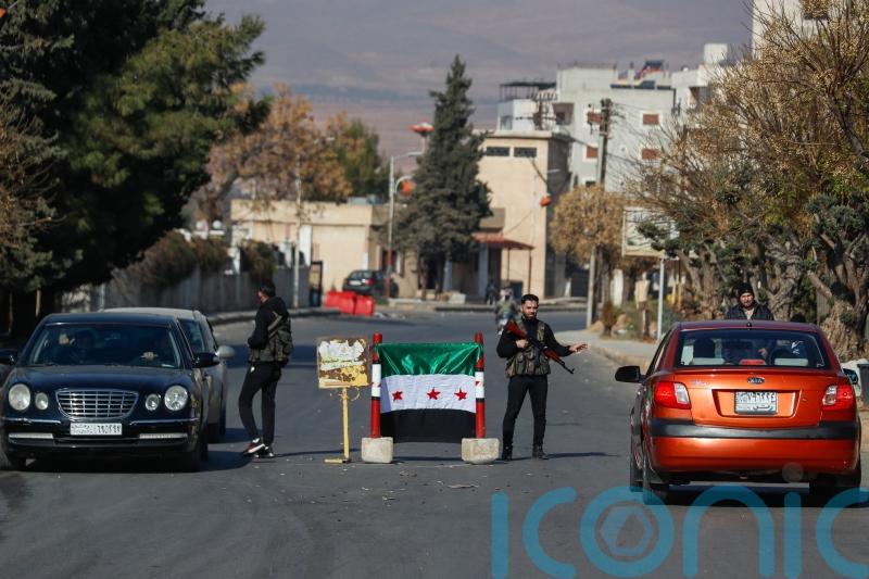 Syrian premier says government still functioning but challenges loom