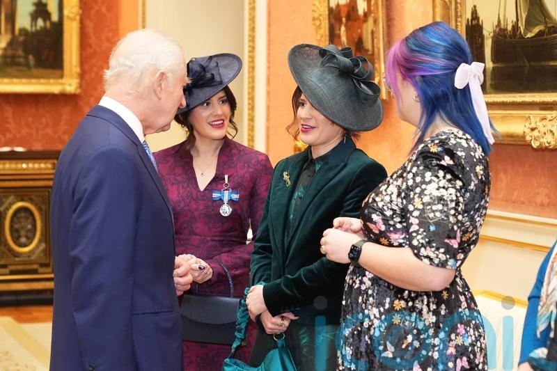 Twin who punched crocodile attacking her sister receives bravery medal from King