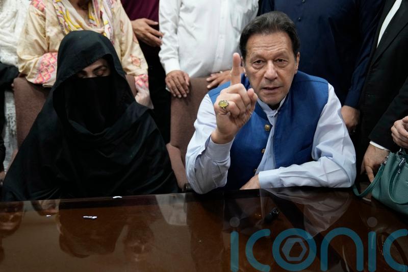 Pakistani court indicts imprisoned ex-PM Imran Khan and his wife for corruption