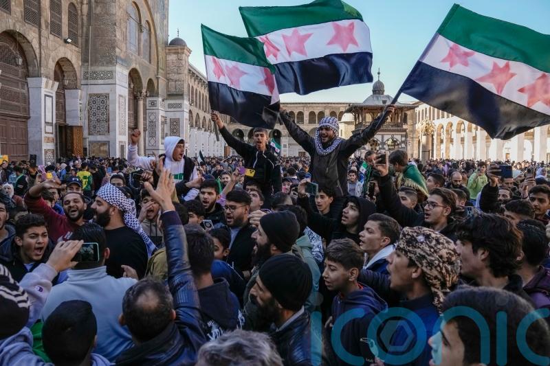 Thousands gather in Damascus to celebrate the toppling of Assad regime