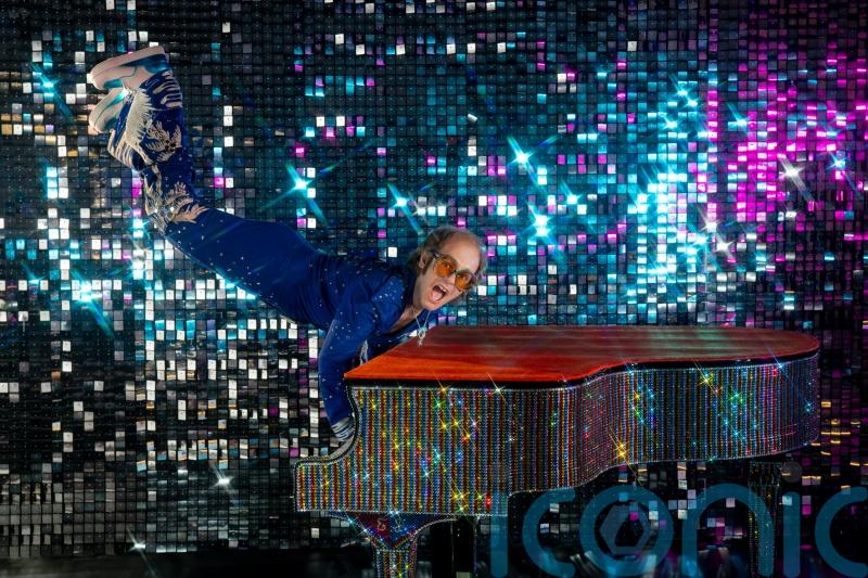 Elton John keyboard handstand waxwork unveiled at London’s Madame Tussauds