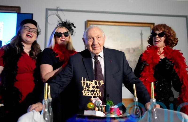 D-Day veteran receives card from King and Queen at surprise 100th birthday party