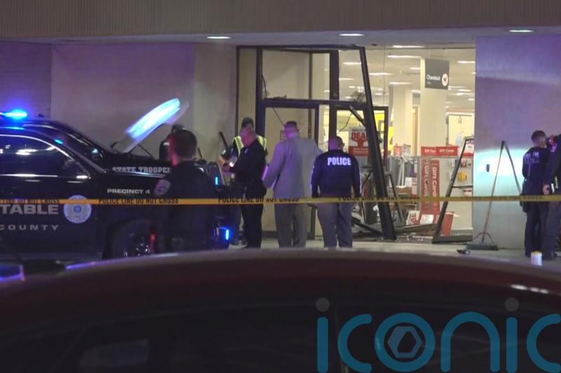 Five hurt as truck being chased by police driven through department store
