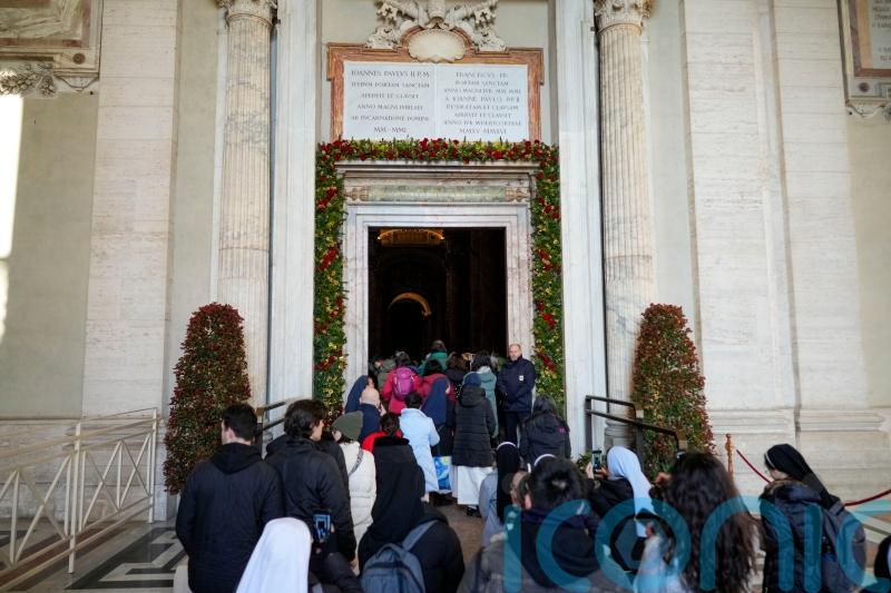 Pilgrims pass through Vatican Holy Door as the 2025 Holy Year begins