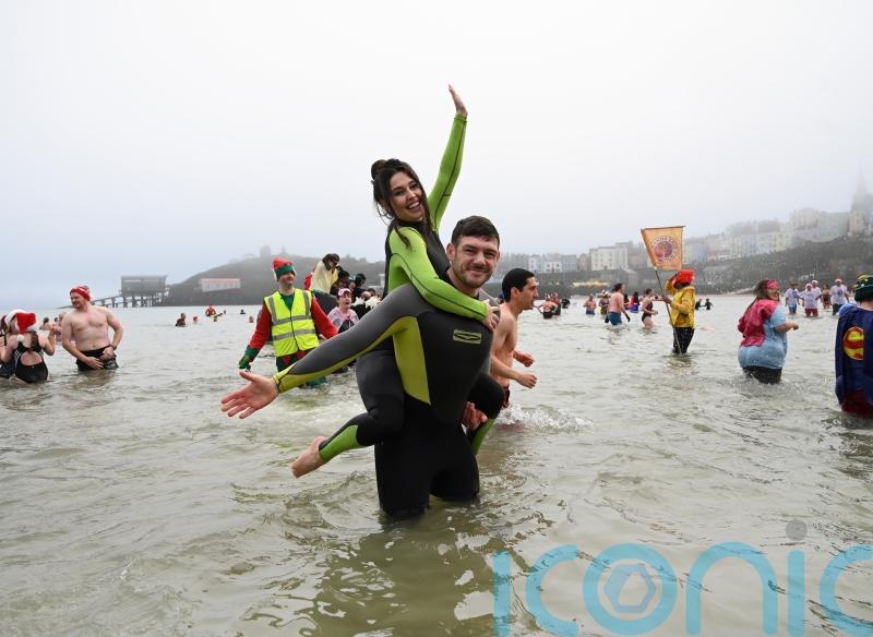 Romantic proposal makes waves at Tenby Boxing Day swim