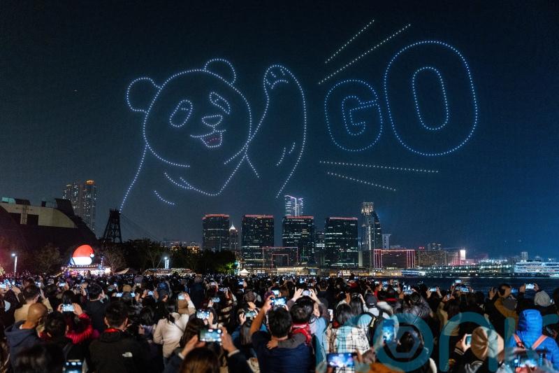 Crowds gather to watch spectacular drone show marking arrival of giant pandas