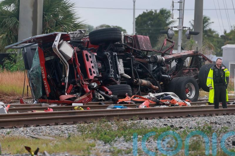 Firefighters and passengers hurt after train hits fire truck on crossing