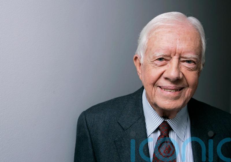 Joe Biden leads tributes to Jimmy Carter following ex-president’s death aged 100