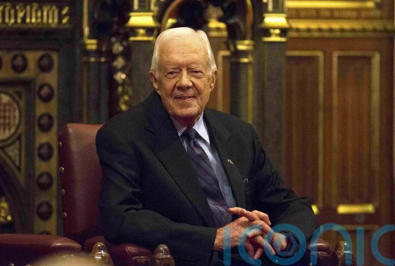 King and PM honour former US president Jimmy Carter after his death aged 100