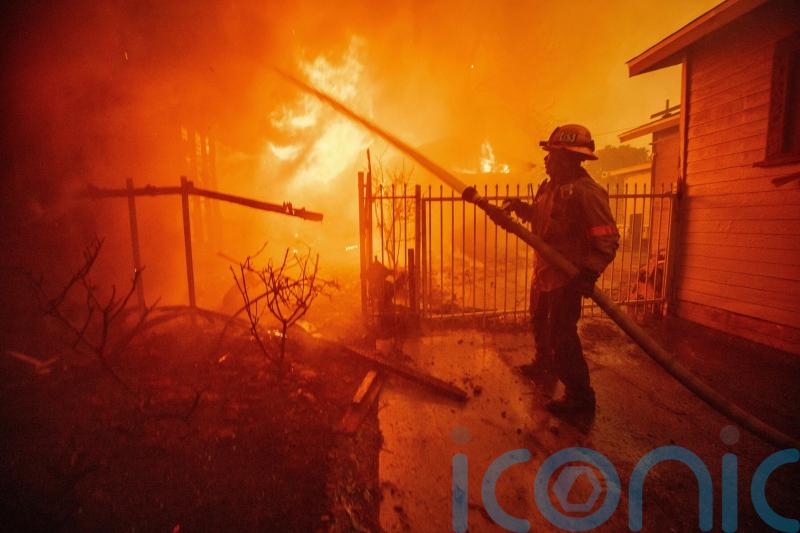 Five dead as wildfires burn out of control across Los Angeles area