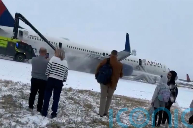Four hurt as Delta plane aborts take-off from snowy Atlanta airport