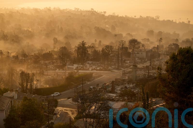 Fires devastating Los Angeles grow more slowly as fierce winds die down
