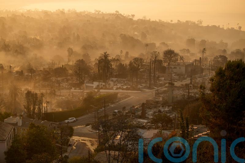 Los Angeles families return to search the ruins of their homes for memories
