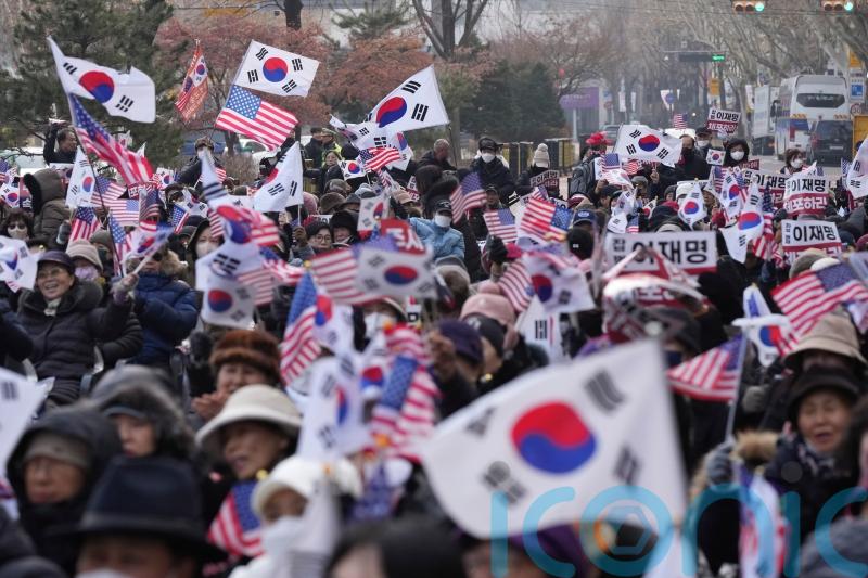 Top aide of impeached South Korean president urges end to detention efforts