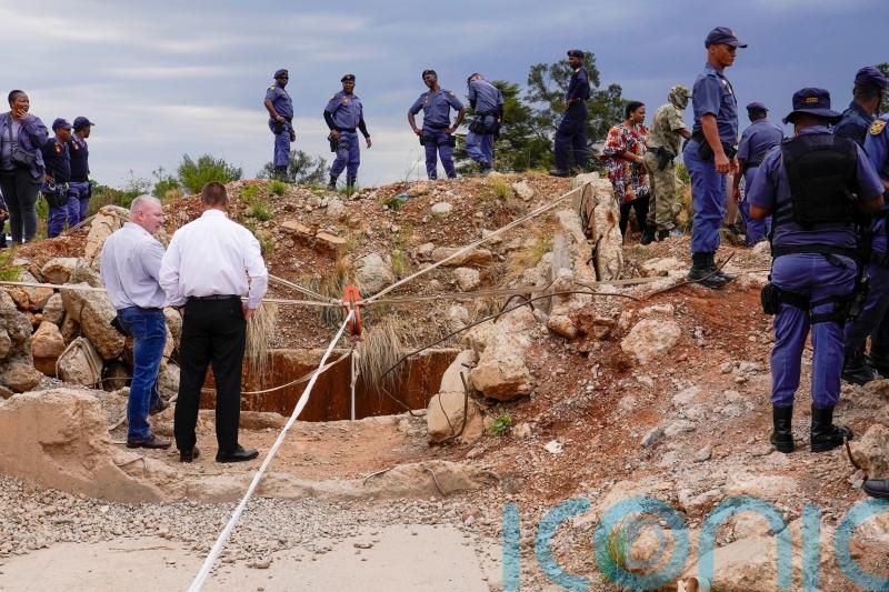 Rescuers bid to bring out survivors among hundreds trapped in South African mine
