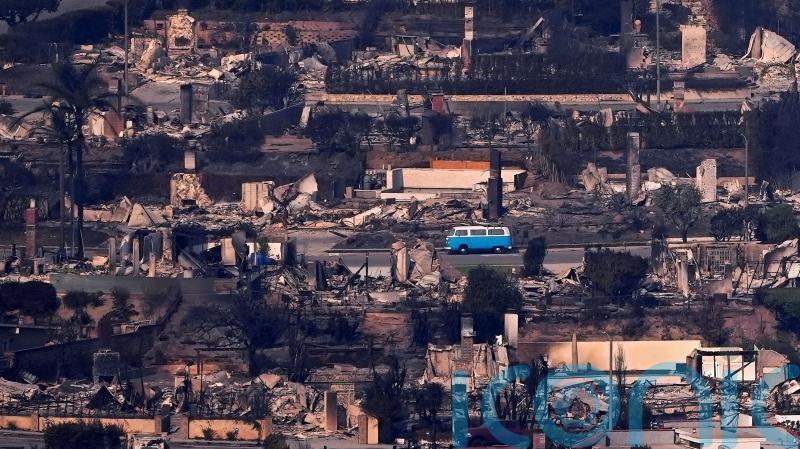 ‘It should have been toasted’: Retro blue VW van survives deadly LA wildfire