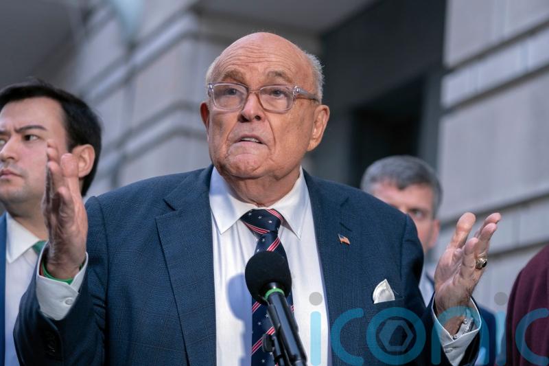 Giuliani reaches settlement over home and baseball rings in defamation case