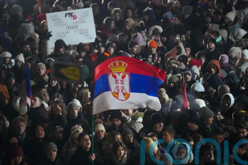 Tens of thousands protest outside Serbian TV HQ after student badly injured