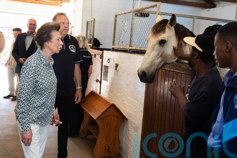 Maverick the pony kicks up a fuss as Anne visits stables in South Africa