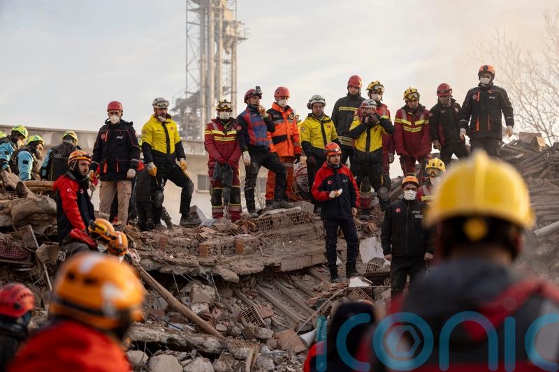 Two people trapped after apartment building collapses in central Turkey