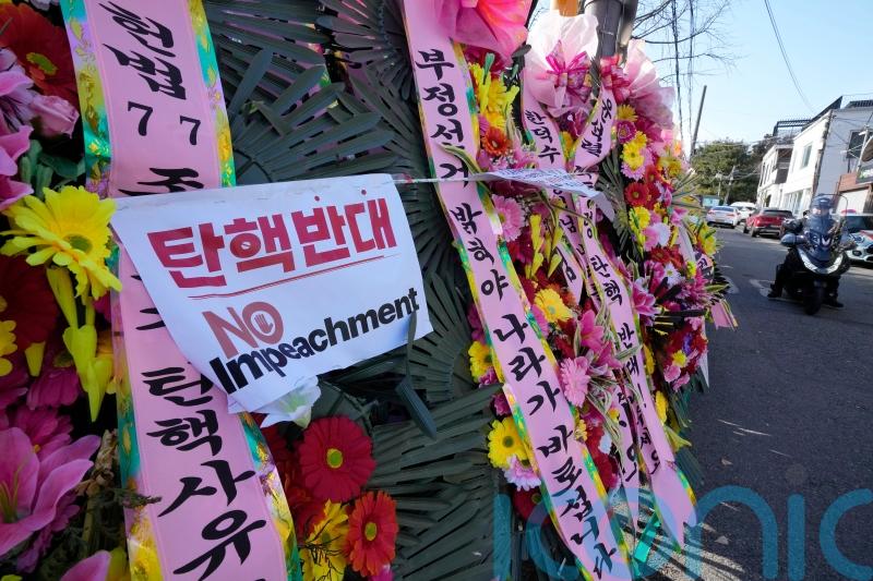 South Koreans turn to flower wreaths and K-pop light sticks as political symbols
