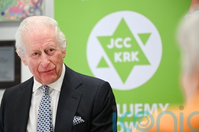 King pays tribute to Holocaust survivors amid Auschwitz commemorations
