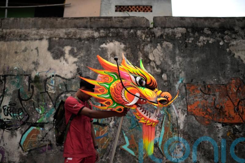 In Pictures: Indonesia welcomes the Year of the Snake with dragons and drums