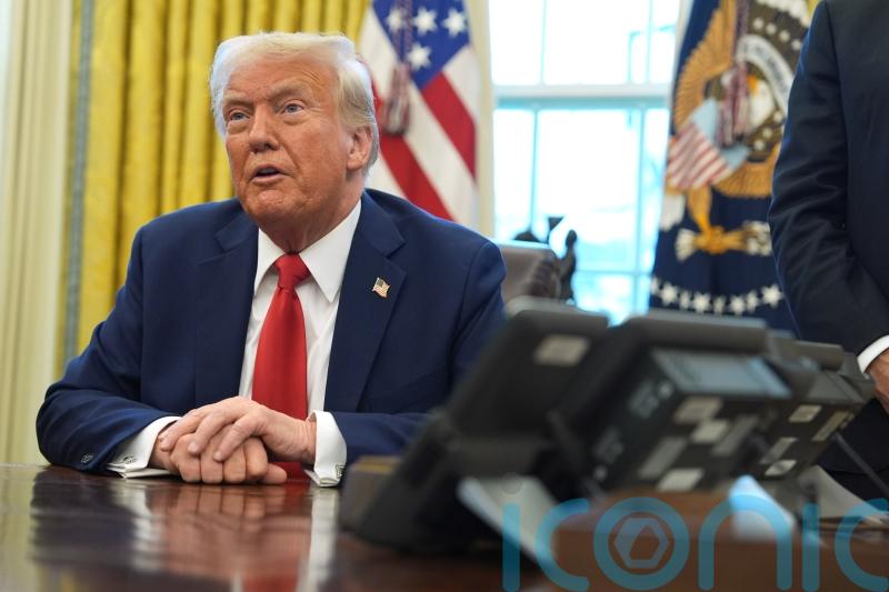 Wall Street falls as Trump imposes tariffs, but not as badly as feared