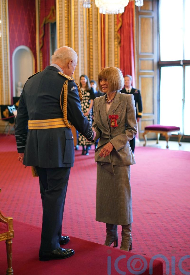 Anna Wintour says she will not stop working as she is honoured at palace