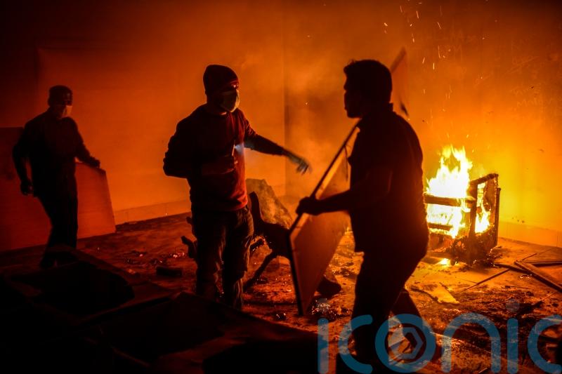 Bangladeshi protesters storm and destroy house linked to exiled former PM Hasina