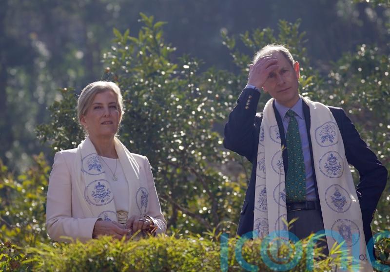Edward and Sophie joke together and hold hands on tour of Nepali botanic garden
