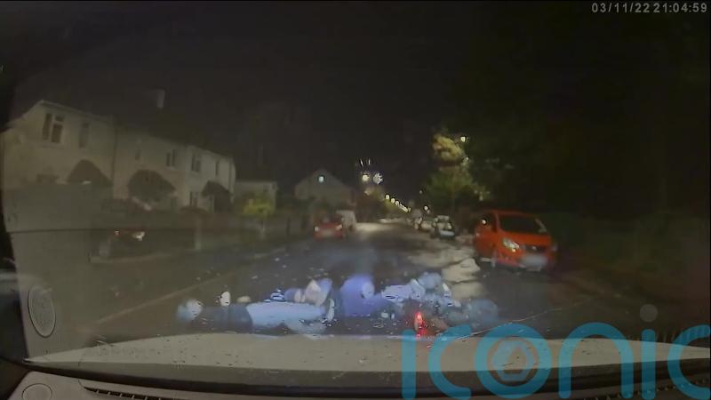 Footage released of moment police car knocks two men off electric motorbike