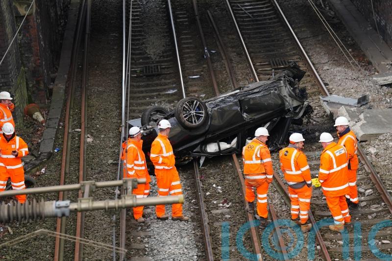 Major train line reopens after crashed car is removed from tracks