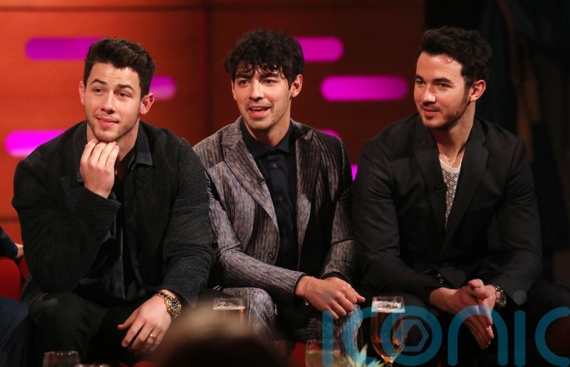 Jonas Brothers thank fans for 20 years’ support and tease new music and movie