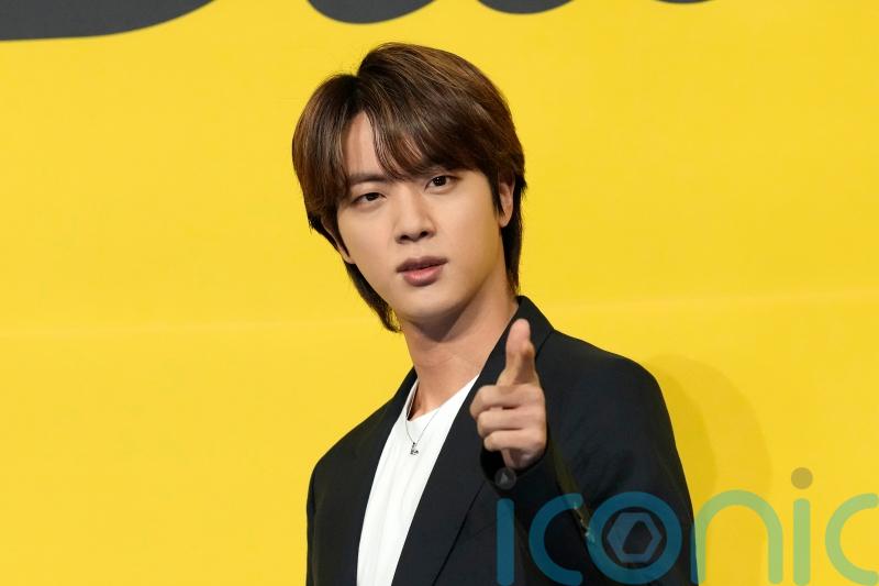 Japanese woman wanted for questioning for kissing BTS member without consent