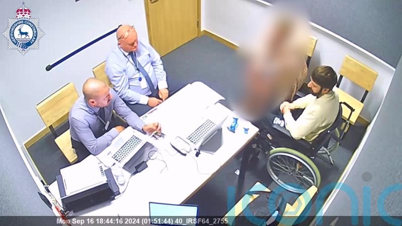 Triple killer sits impassively in wheelchair and answers no comment in interview
