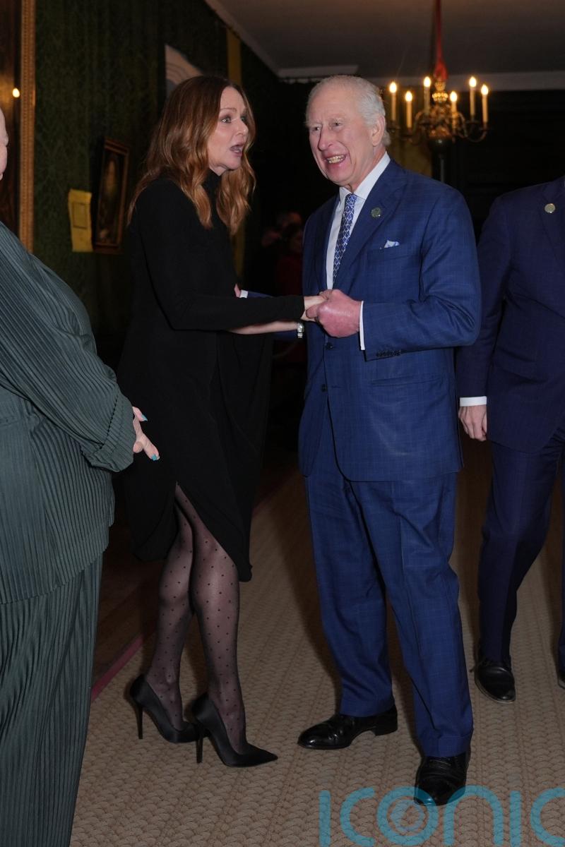 King jokes with guests and views exhibitions at sustainability event