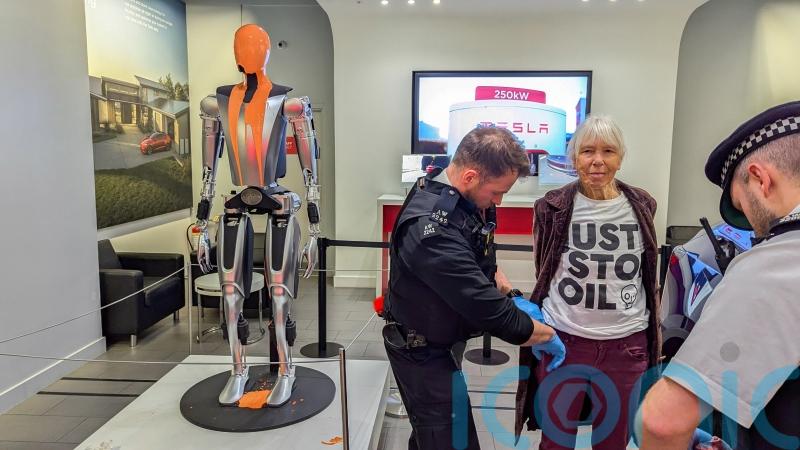 Just Stop Oil protesters arrested after pouring paint over Tesla robot