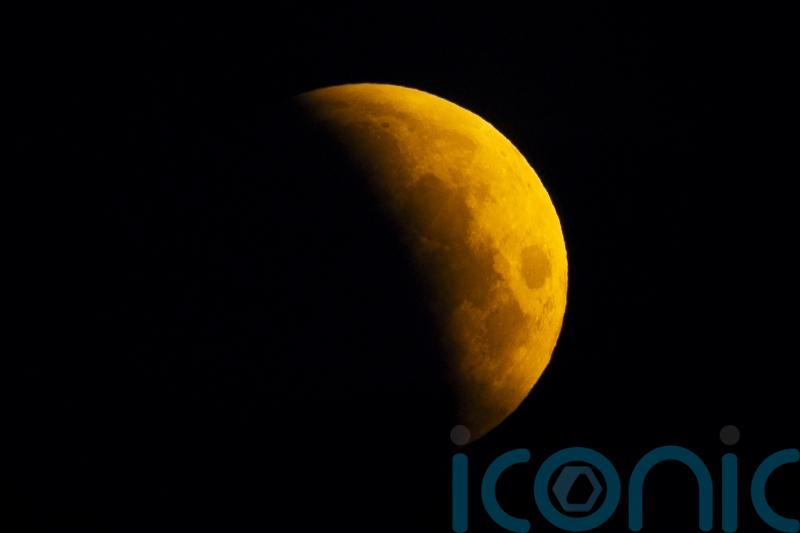 UK stargazers wake up to rare ‘blood moon’ partial lunar eclipse