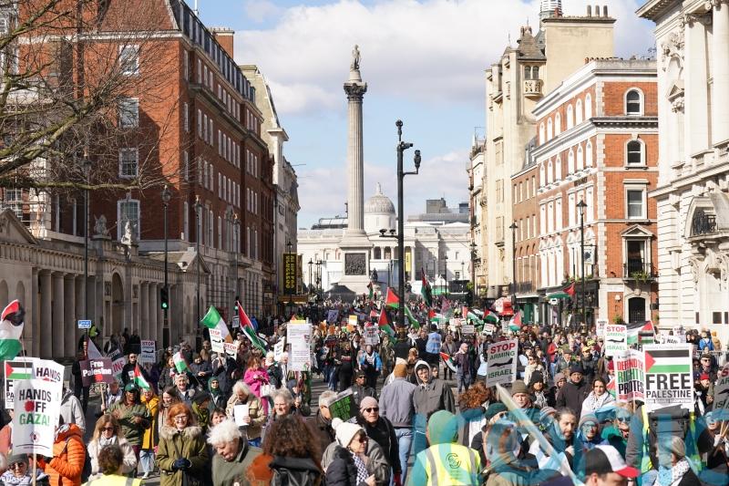 Palestine supporters march through central London